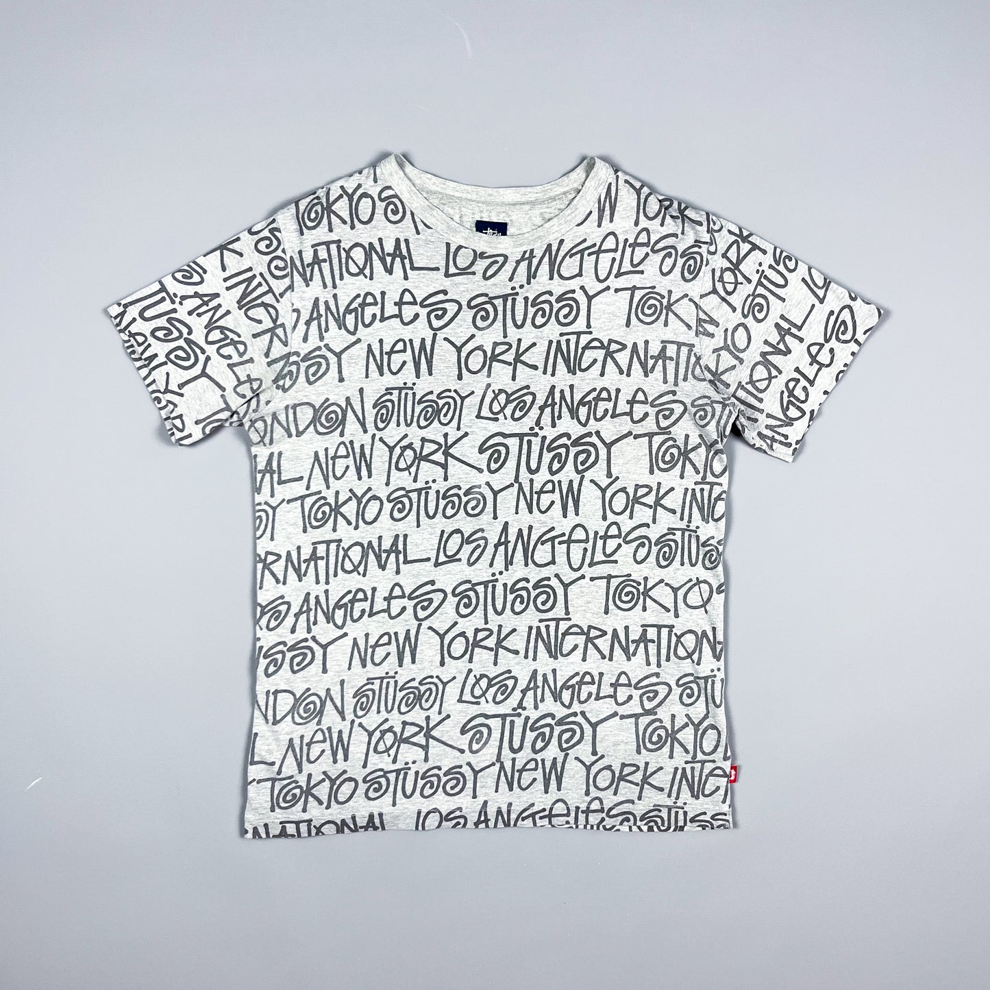 Stüssy All Over Spellout T-shirt - Size: Medium - Grey