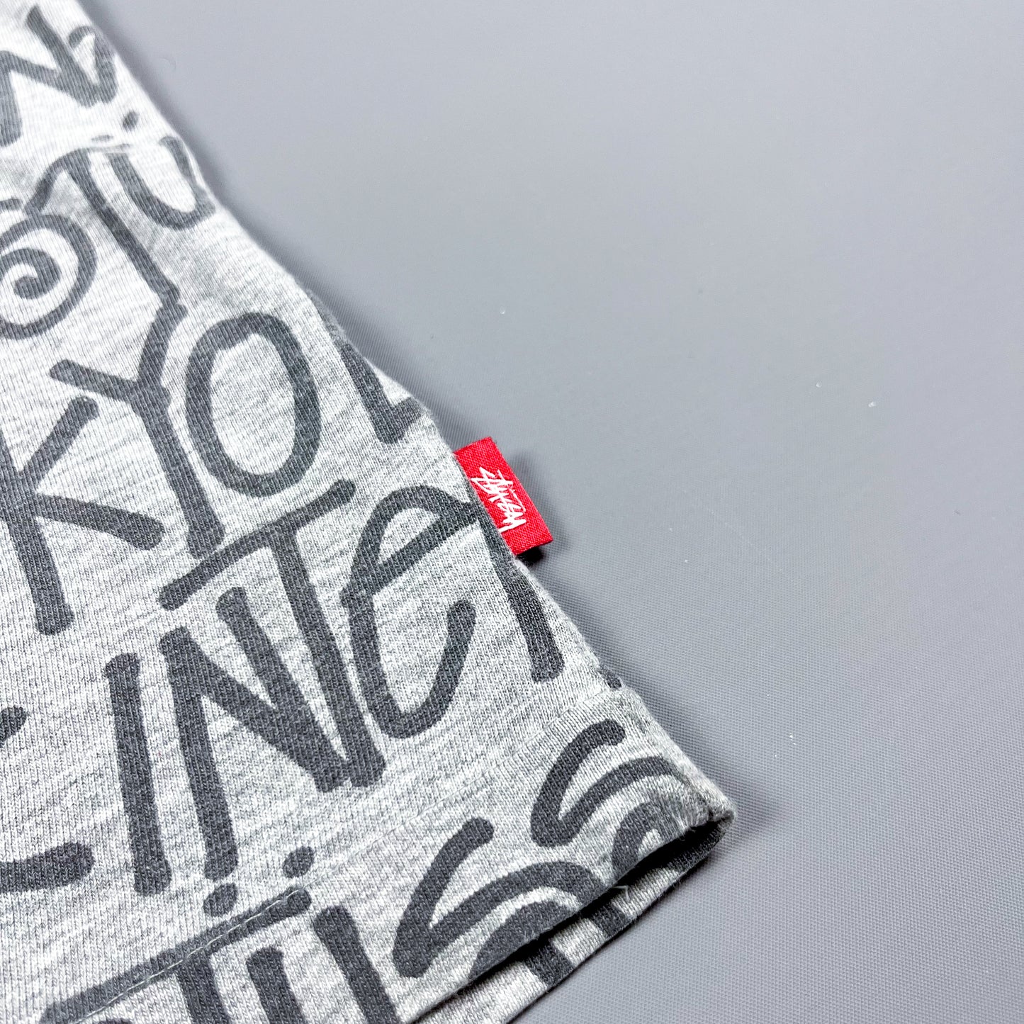 Stüssy All Over Spellout T-shirt - Size: Medium - Grey