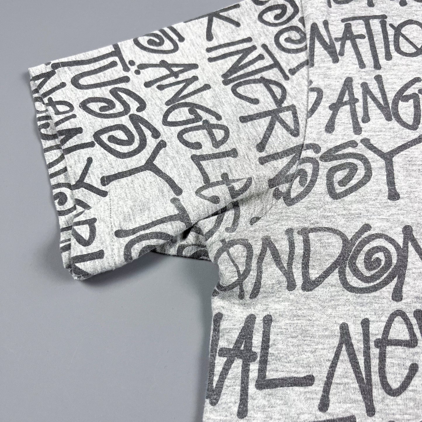 Stüssy All Over Spellout T-shirt - Size: Medium - Grey