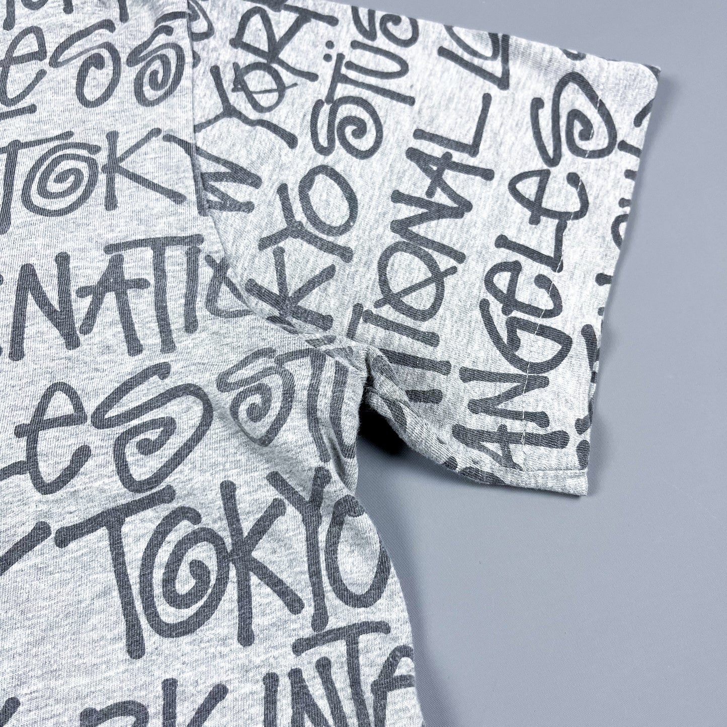 Stüssy All Over Spellout T-shirt - Size: Medium - Grey